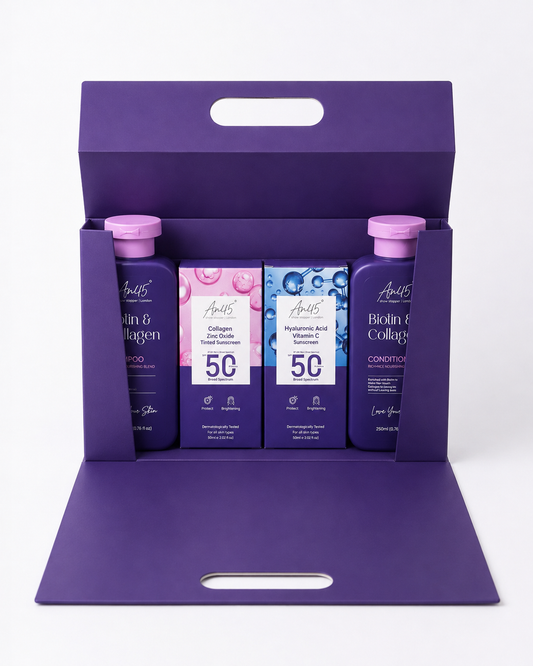 AN45° Rakhi Gift Hamper — the purple keepsake box opened, with the Biotin & Collagen Shampoo, SPF 50 Tinted Sunscreen, SPF 50 Sunscreen Fluid and Biotin & Collagen Conditioner inside